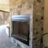 Drystack outdoor fireplace with natural stone veneer