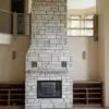 Custom Coastal Mist Fireplace with colored stone removed