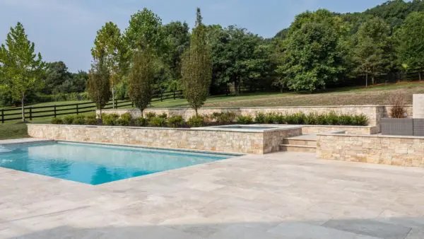 Poolside landscape showing the Quarry Mill's Primavera thin stone veneer.