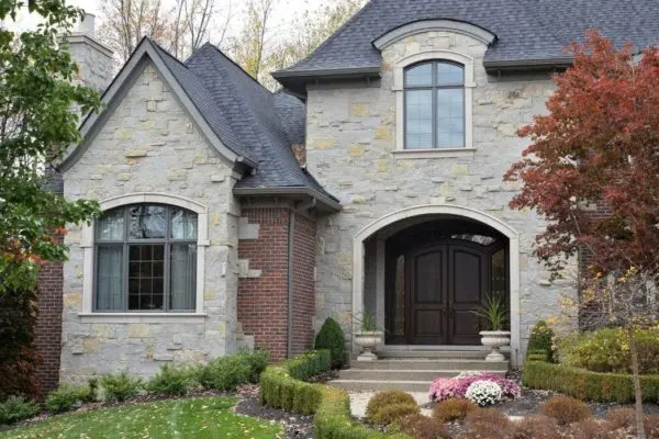 Front Entrance, Accent Wall, and Chimney with Charcoal Bluff Real Thin Stone Veneer