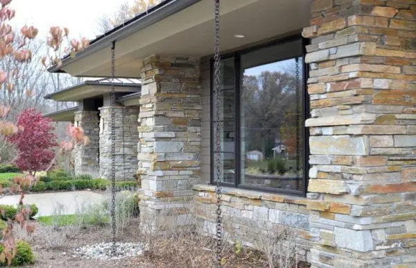 Side View of House with Natural Stone Pillars and Wainscoting