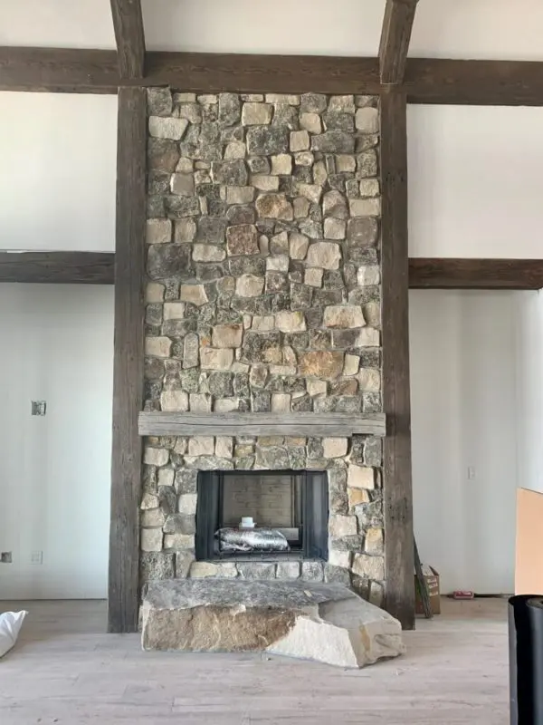 Moss Rock thin stone veneer installed on a fireplace