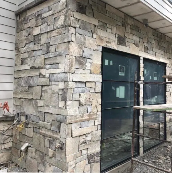 Home Exterior with Custom Drystack Natural Stone Veneer