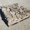 A stock pallet of moss rock natural thin stone veneer