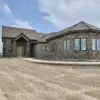 Front View of Home with Moss Rock Real Stone Veneer