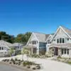 Curb View of Luxury Lake Home with Bismarck Real Stone Veneer Siding