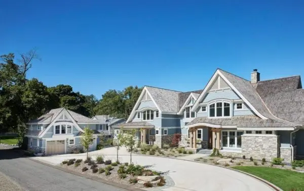 Curb View of Luxury Lake Home with Bismarck Real Stone Veneer Siding