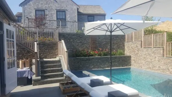 Outdoor Living Area with Pool and Cape Cod Natural Stone Veneer