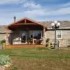 Ranch Style Home Wainscoting and Front Porch with Savannah Natural Stone Veneer