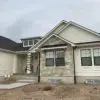 Home Exterior with Roanoke Custom Dark Real Stone Veneer