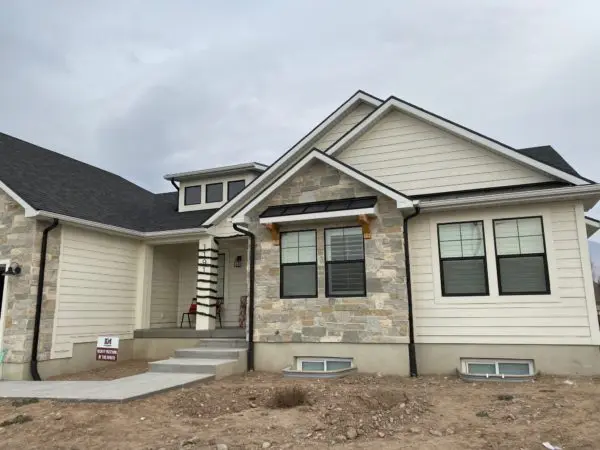 Home Exterior with Roanoke Custom Dark Real Stone Veneer