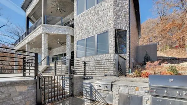 Outdoor Living area with grill with Chamberlain natural stone veneer