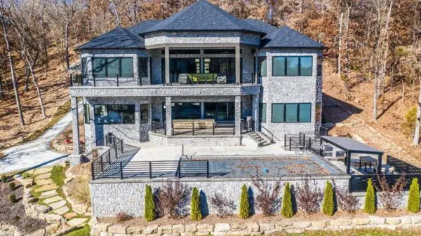 Back view of house and outdoor living with Chamberlain real stone veneer