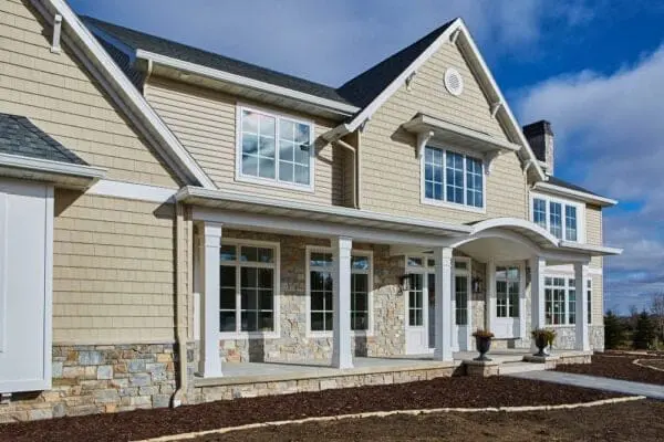 Home exterior with Chamberlain real thin stone veneer and tan mortar