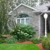 Home Exterior with Seaside Real Stone Veneer