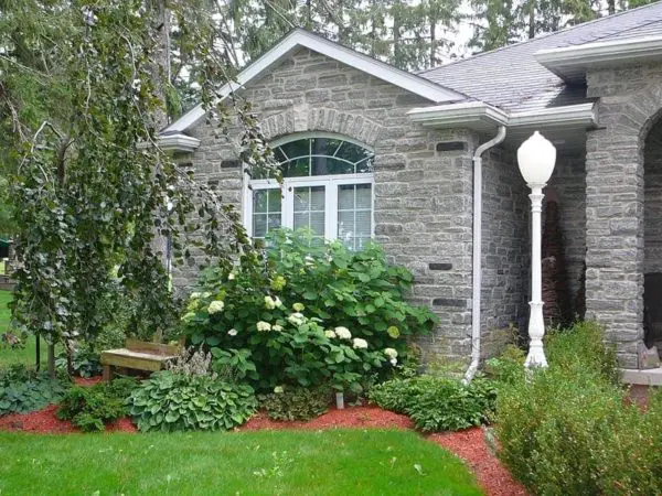 Home Exterior with Seaside Real Stone Veneer