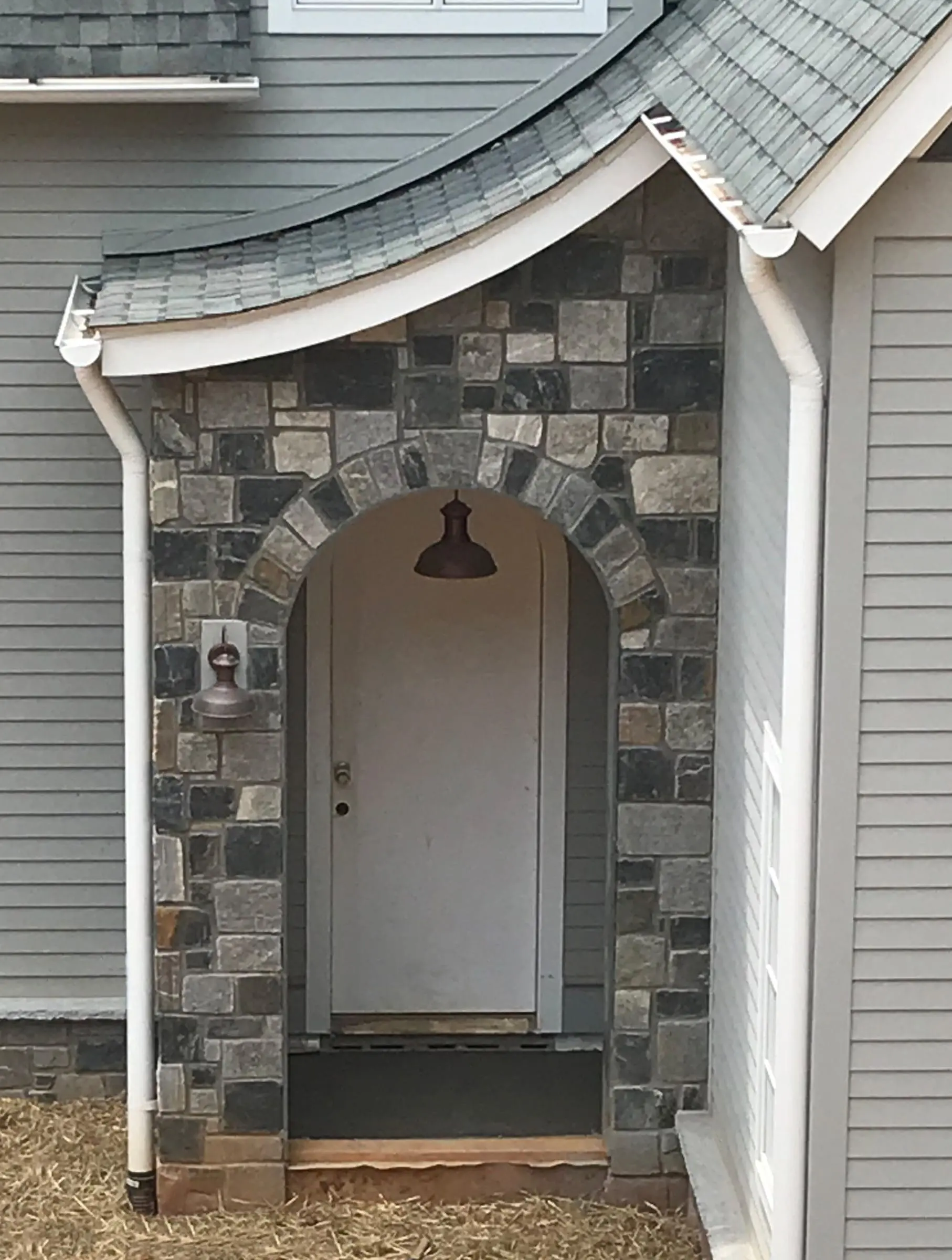 Side entrance with Carlisle real thin stone veneer accent wall