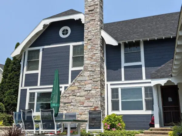 Dutch colonial house with Avondale natural thin stone veneer chimney