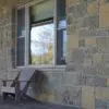 Front porch accent wall with Castle Ridge and Baltic Hills natural stone veneer