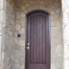 Front entrance with custom mosaic style tumbled Castle Ridge natural stone veneer