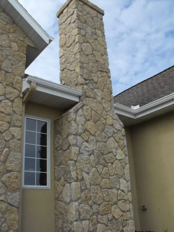 Chimney with custom mosaic tumbled Castle Ridge natural stone veneer