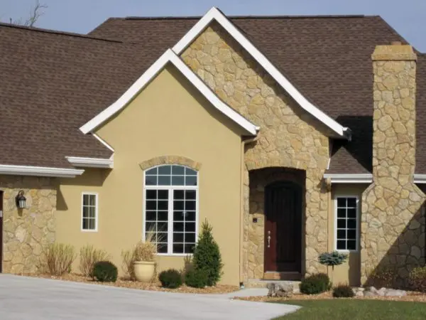 Exterior with custom mosaic tumbled Castle Ridge real stone veneer