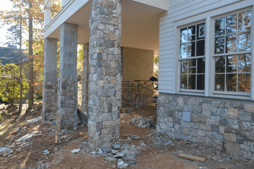 Wainscoting and pillars with Foxborough natural thin stone veneer