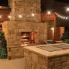 Outdoor patio and fireplace with Newcastle dimensional natural thin stone veneer