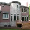 Backyard accent wall with Promenade tumbled natural thin stone veneer