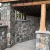 Covered patio with Rochester castle rock style real thin stone veneer