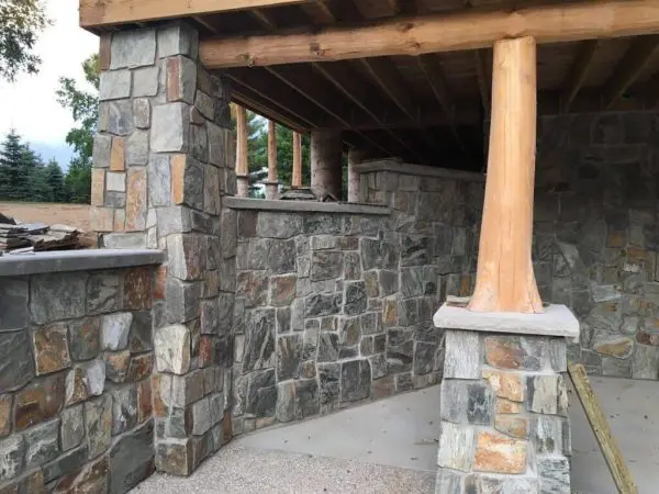 Covered patio with Rochester castle rock style real thin stone veneer