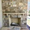 Outdoor fireplace with Rochester and Whistler natural stone veneer