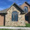 Exterior accent wall with Bonavista mosaic natural stone veneer