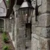 Home exterior and outdoor living area with Reedley castle rock style real stone veneer