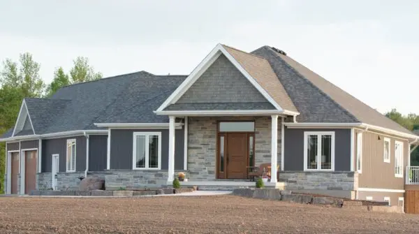 Jacksonport and Pembroke Natural Stone Veneer Blend Exterior with White Mortar