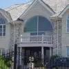 Alpine Dimensional White Real Stone Veneer Exterior Paired with Brick