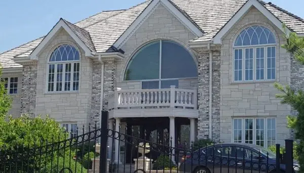 Alpine Dimensional White Real Stone Veneer Exterior Paired with Brick