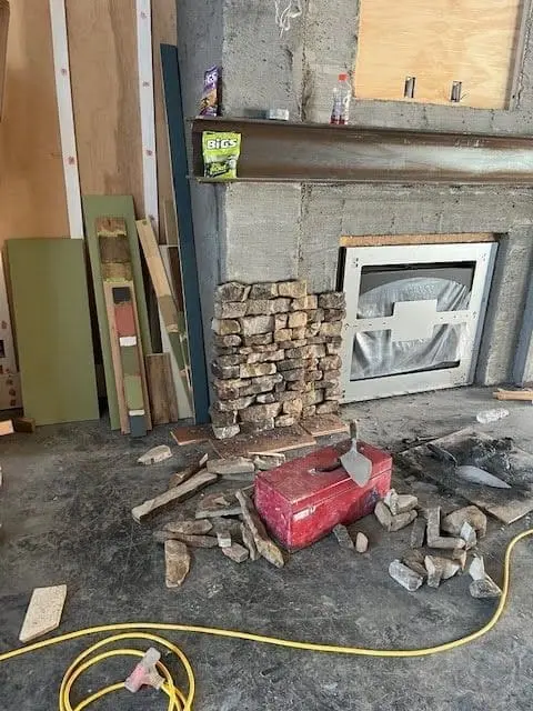 Real stone veneer being installed on a fireplace