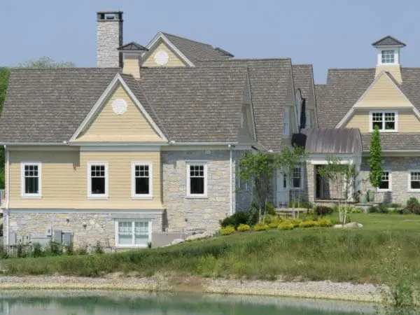 Chateau and Nottingham Natural Stone Veneer Country Home Exterior