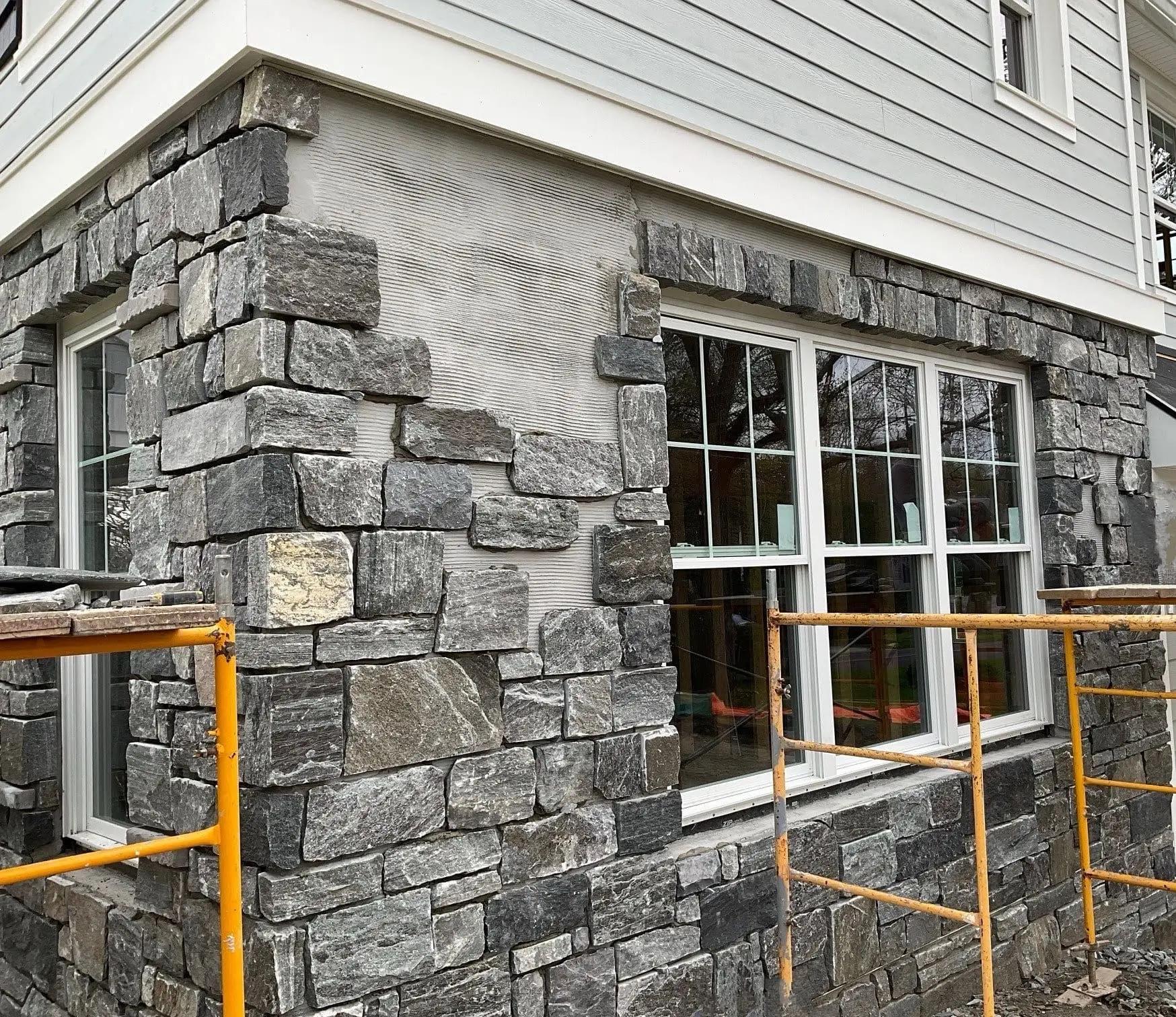 Monroe Natural Thin Stone Veneer Exterior with Custom Dark Pieces