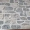 Duluth and Chateau Real Thin Stone Veneer Blend Fireplace Close Up with White Mortar