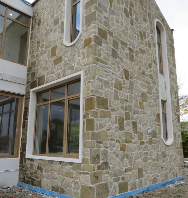 Colonial and Chateau with Large Pieces Real Stone Veneer Exterior