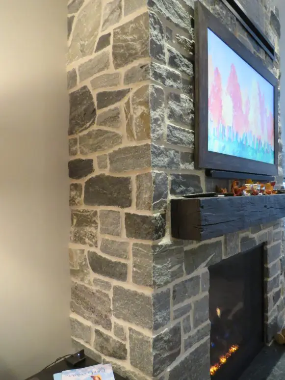 Timmins Natural Stone Veneer with Custom Dark Pieces Interior Fireplace Close Up