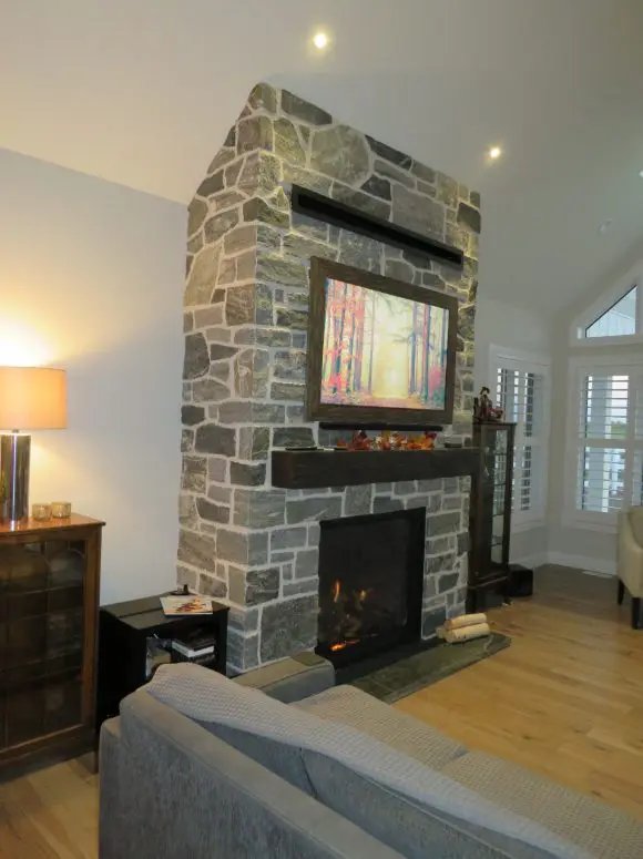 Timmins Natural Stone Veneer with Custom Dark Pieces Interior Fireplace