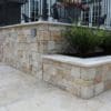 Landscape wall with thin stone veneer