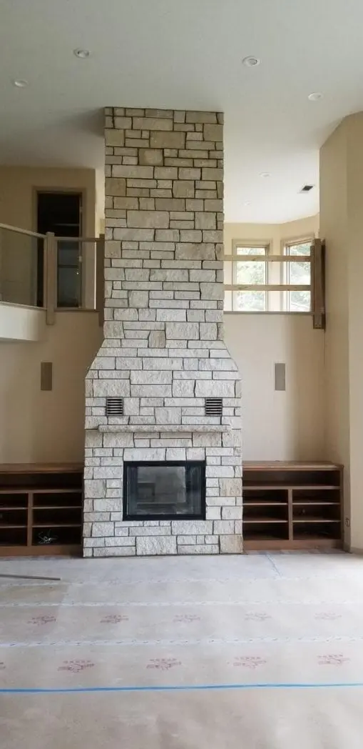 Custom Coastal Mist Fireplace with colored stone removed