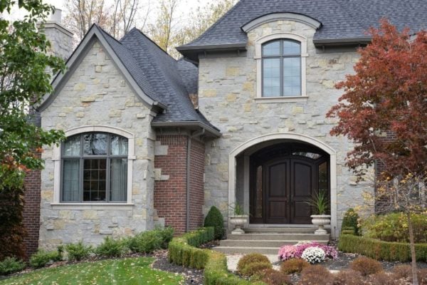 Front Entrance, Accent Wall, and Chimney with Charcoal Bluff Real Thin Stone Veneer