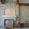 Living Room with Charcoal Bluff Overgrout Interior Walls and Fireplace