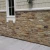 Tumbled natural stone veneer exterior masonry