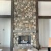 Moss Rock thin stone veneer installed on a fireplace